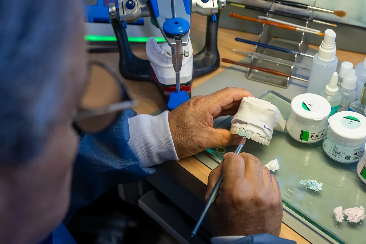 Technician working at the bench in the Elite Prosthetic Dentistry in-house dental laboratory